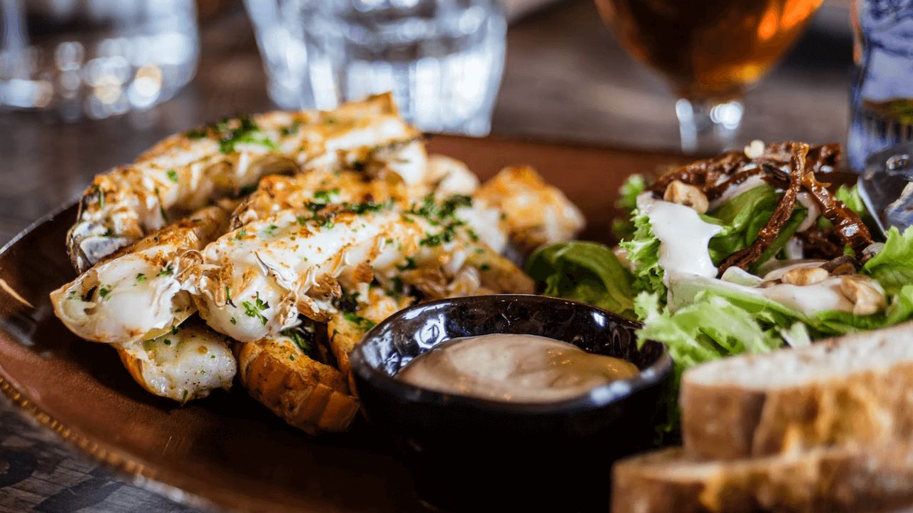 Bread, hummus, and salad on a plate.