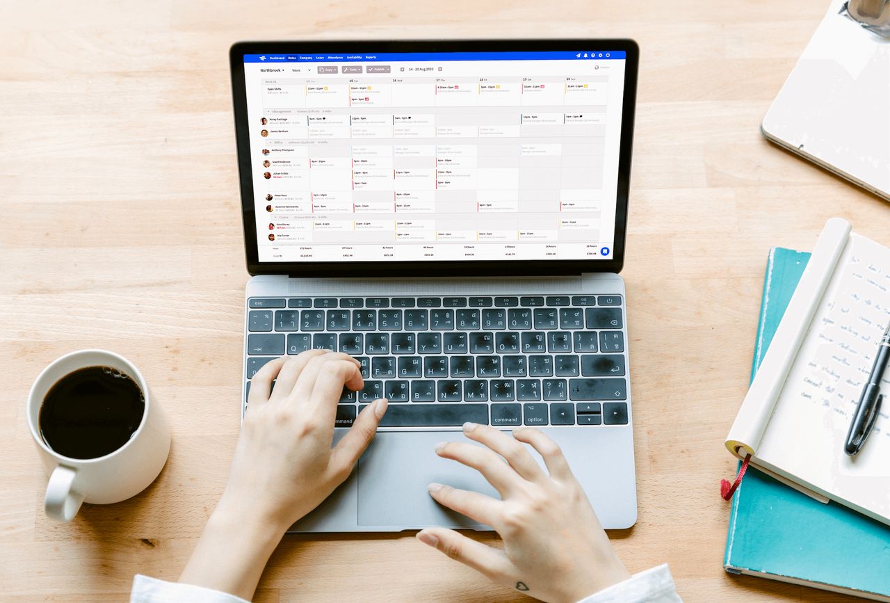 Top-down photo of pair of hands using a laptop computer running RotaCloud