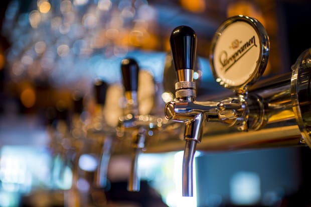 Close-up photo of beer taps in a bar